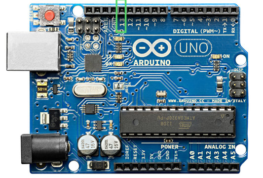 A photo of an Arduino board with a red circle around the onboard LED, which is labeled 'L'.